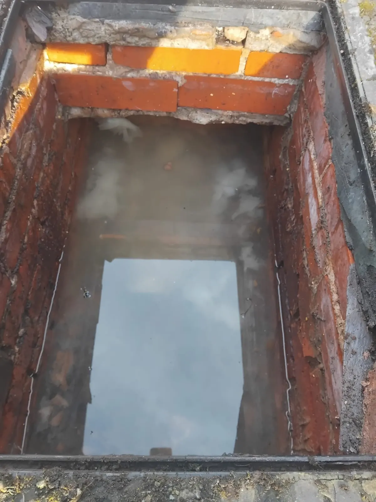 Blocked drainage inspection chamber filled with water